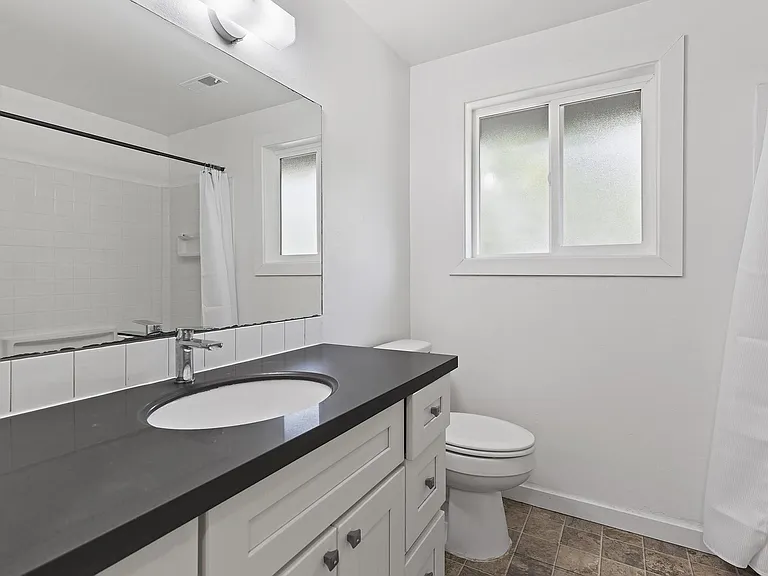 Upgraded Bath with New Screened Window & Refinished, Sparkling Like-New Tub and Shower Surround.