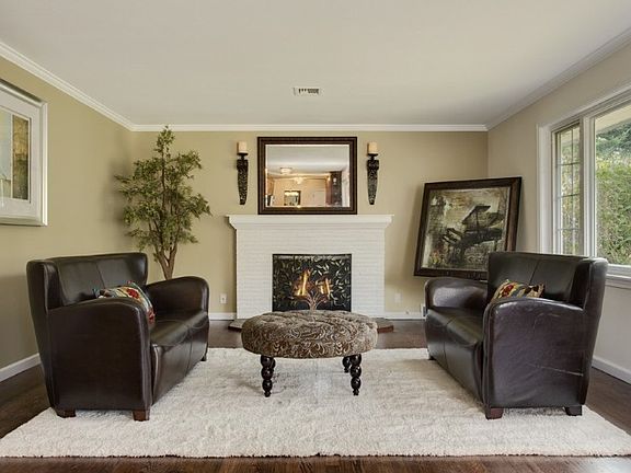Nice size living room with warm fireplace and large picture window