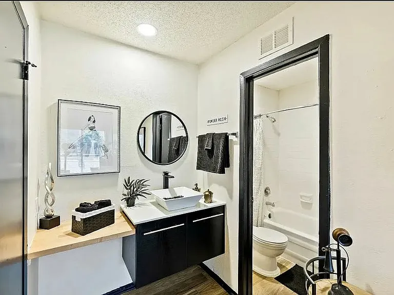Experience modern living at The WerX. This stylish bathroom features contemporary fixtures, sleek finishes, and ample storage for your convenience. Elevate your lifestyle in a space designed for comfort and functionality. Schedule a tour today!