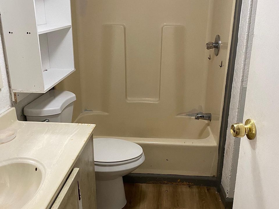 Bathroom (washer and dryer connections located in bathroom behind door)