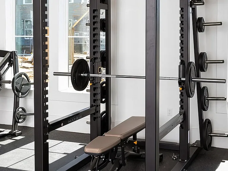 Strength Training Setup with Bench and Barbell in Functional Fitness Room