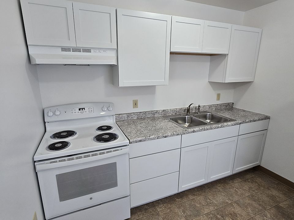 New countertop with updated faucet and sprayer.