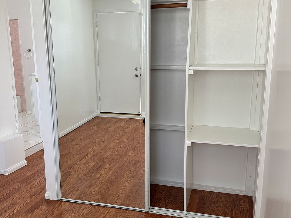 Large closet with built in shelves.