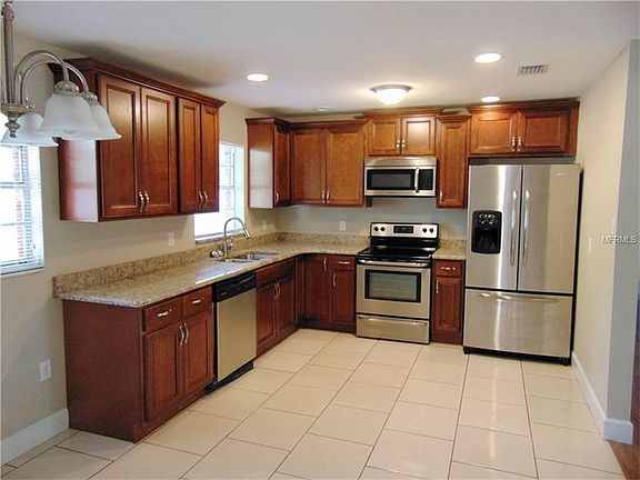 View of remodeled kitchen with new cabinets and granite counter tops