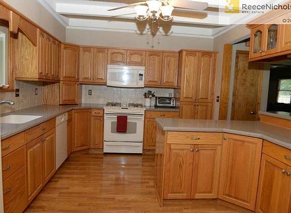 Great picture of the kitchen with gas range, plenty of cabinets,