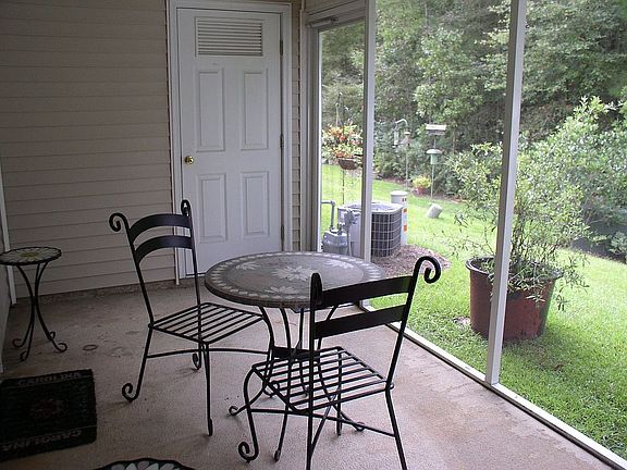 Large screen porch, backs to woods.