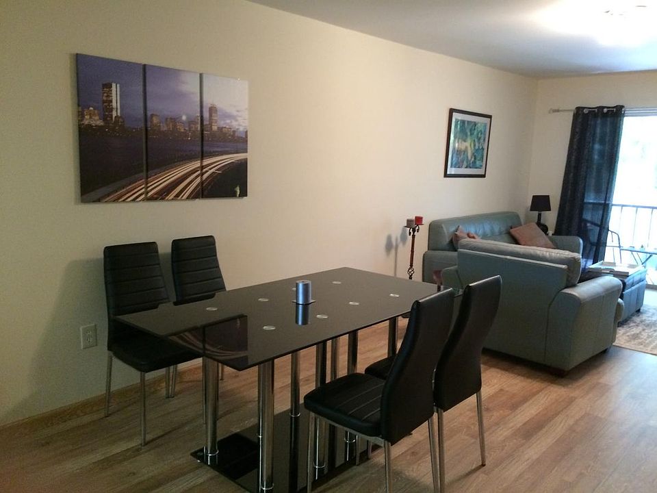 Spacious dining room area with seating for 6, opening up to 