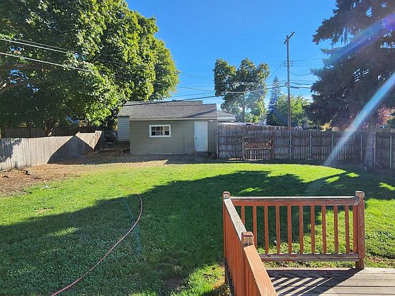 Large backyard with large deck and detached garage