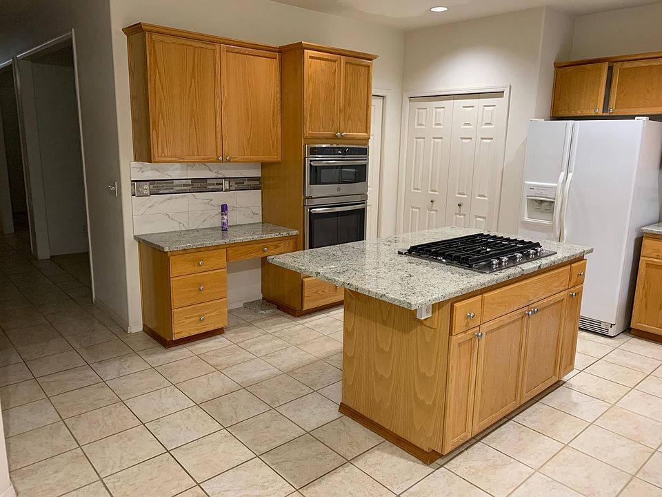 kitchen with granite countertops and tiled floor