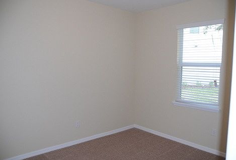 Master bedroom has stepped ceilings and fan