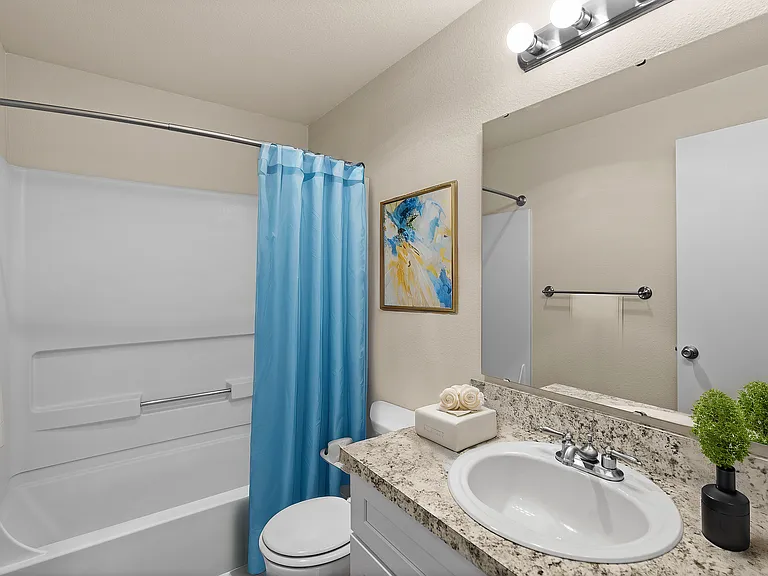 Step into serenity with this stylish bathroom, featuring contemporary finishes and soothing decor.