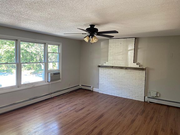Living room with faux mantle