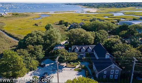 Aerial shot showing proximity to scenic bike path and harbor.
