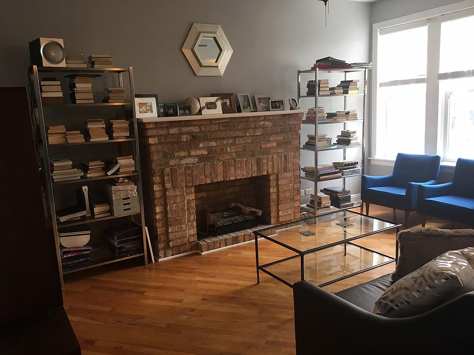 bright living room connecting to front office/dining room
