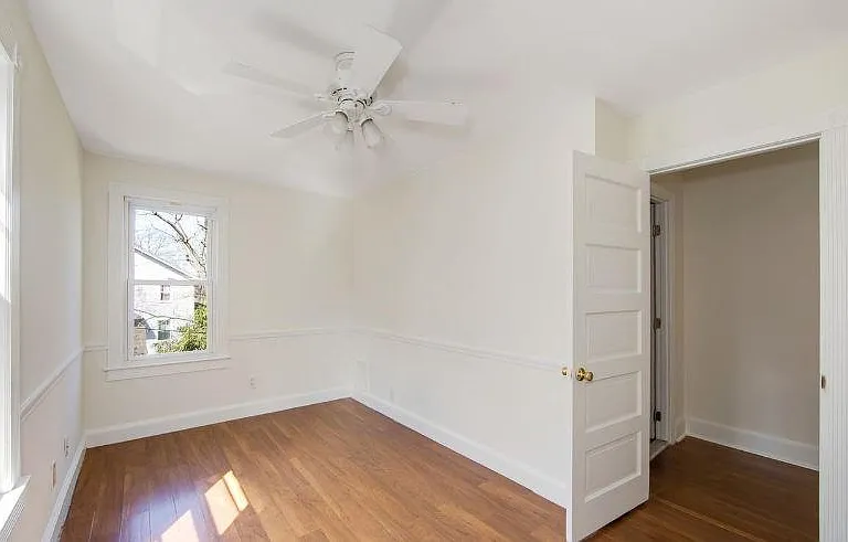 Bedroom 1 - back of house by bathroom with custom shelving in closet