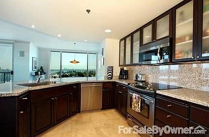 Gourmet Kitchen with View West/South
						:
						Lots of cabinet space with stainless appliances, open to the living and dining.