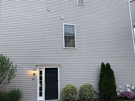 Side of home with new entry door