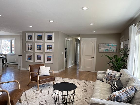 Looking left to the kitchen and straight down the hallway to the laundry facilities and the 3 main floor bedrooms