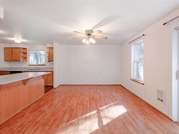 View of dining room located next to the kitchen, patio door to your wrap-around deck to your right. 