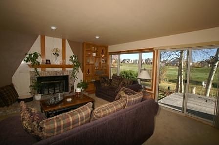 Family room with marble-surrounded gas fireplace!