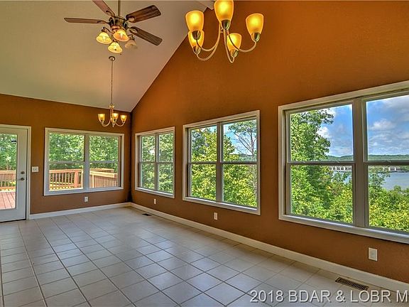 The dining room has extensive views, allowing for a lovely panorama of the lake and surrounding woods.
