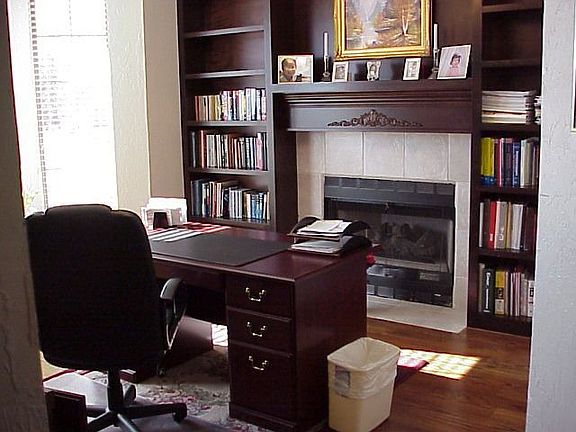 Study with bookcases and fireplace