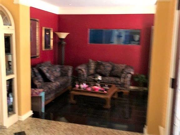 Formal living just off entry. Crown molding