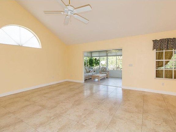 Sunroom Entrance from Living Room... Double Wide Glass Doors that fully open and close. Doors slide into wall.