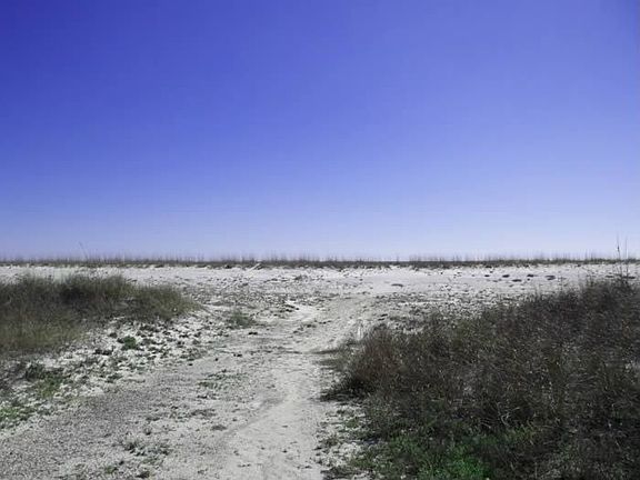 Strategically located right across street from white sand beaches & Gulf waves