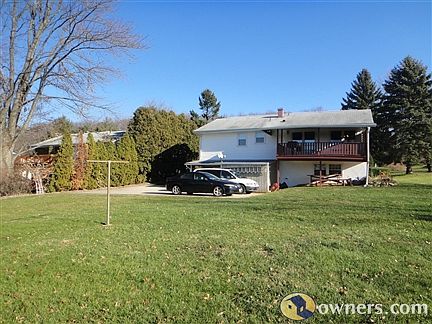 Level back yard with concrete parking pad