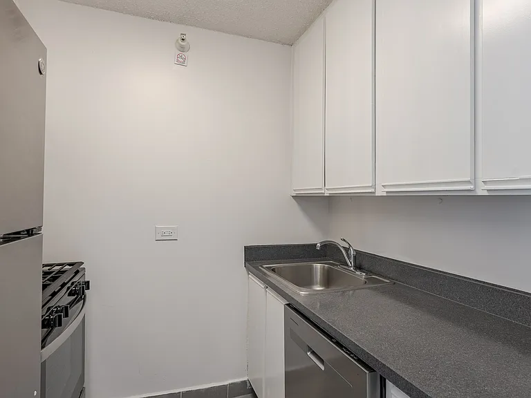 Sleek stainless steel appliances and modern cabinetry