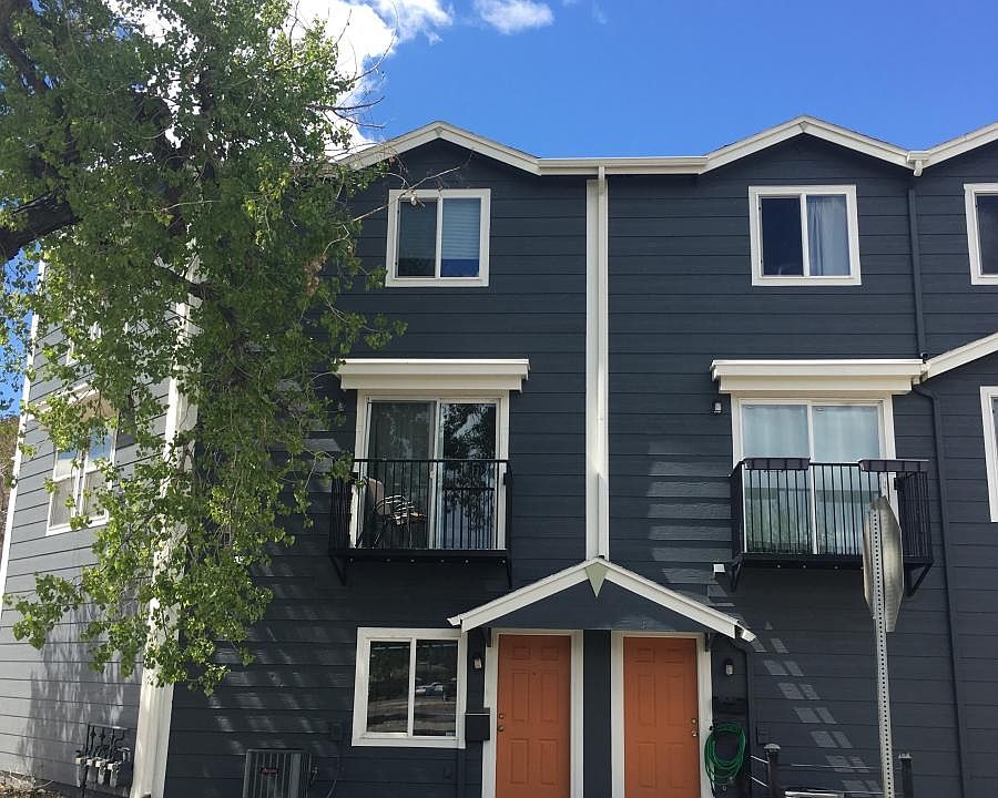 End unit townhome with attached garage and outdoor balcony.