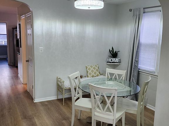 Dining room has crystal same crystal chandelier with retractable blades as well.