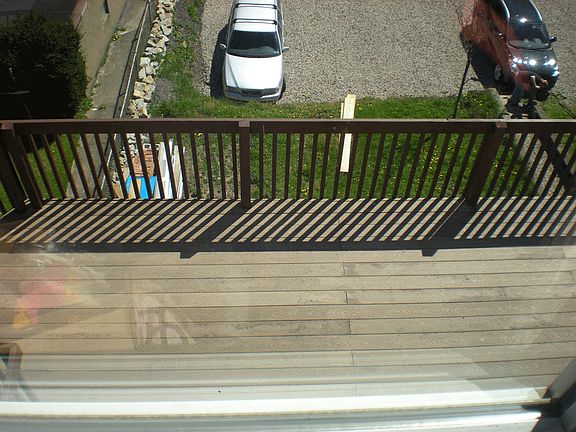 Spacious deck with off-street parking in rear of unit