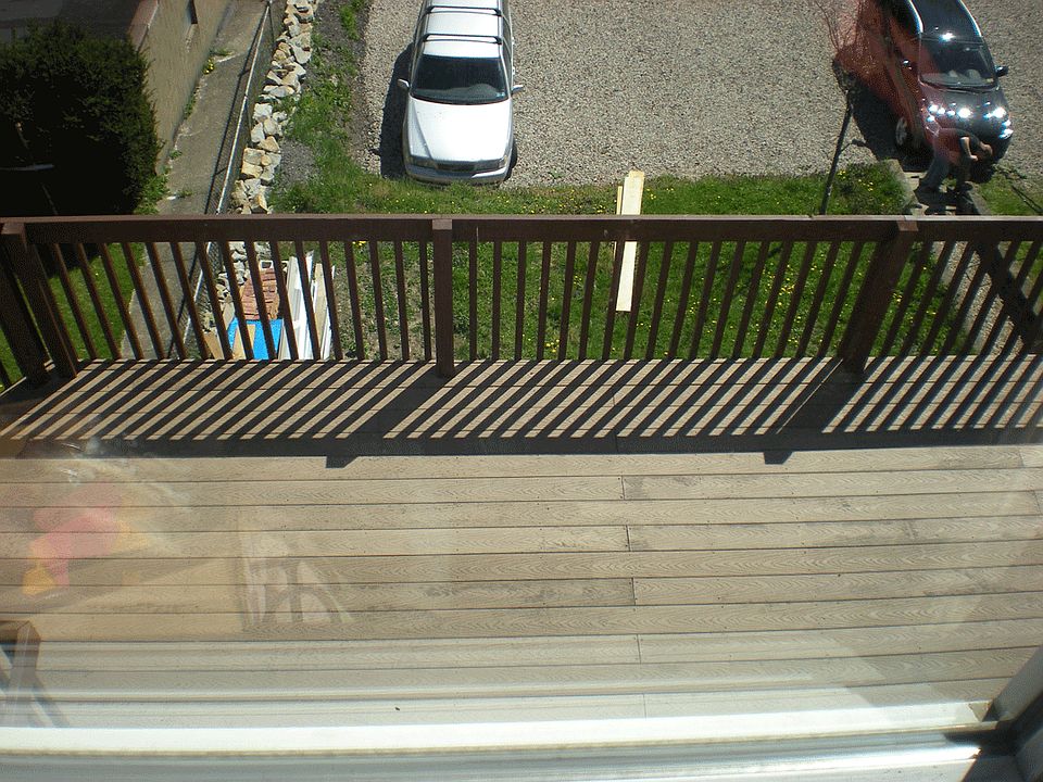 Spacious deck with off-street parking in rear of unit