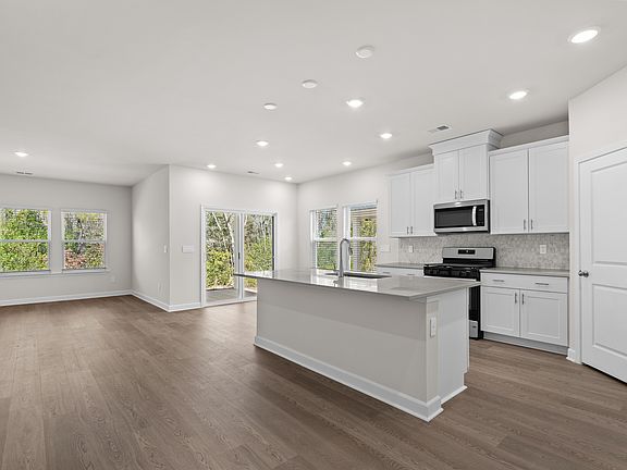 The stunning open-concept floorplan allows for easy flow between the kitchen and dining areas.