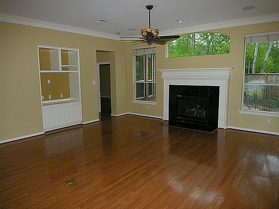 Richly Stained Hardwoods, Built-In Entertainment Center, Gas Log Fireplace