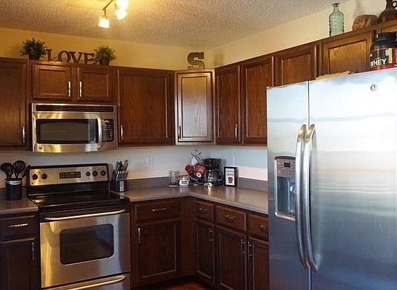LOVE stainless appliances and a corner wall cabinet? You've got it!