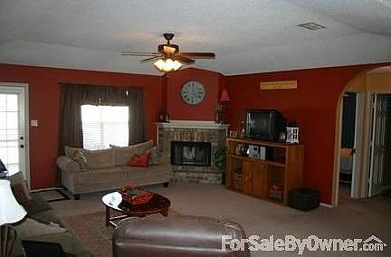 Living Room
						:
						View from kitchen into living room. Living room has fireplace, new ceiling fan