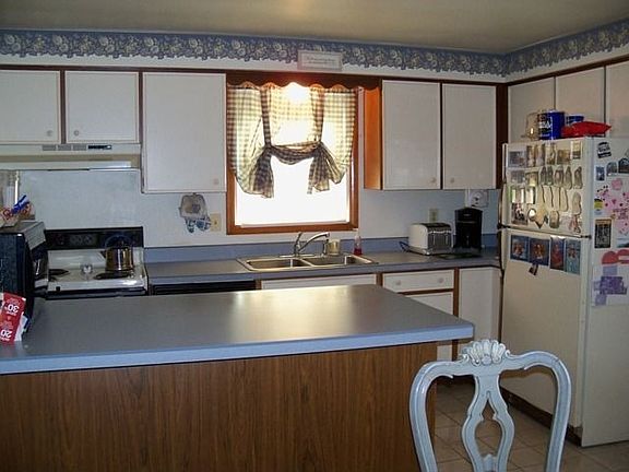 island in kitchen offers more cabinet space below