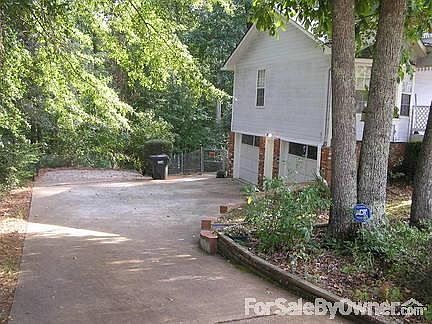 LOOKING DOWN THE DRIVEWAY AND GARAGE