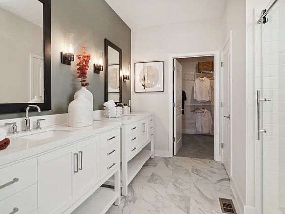 Primary bath with freestanding vanities