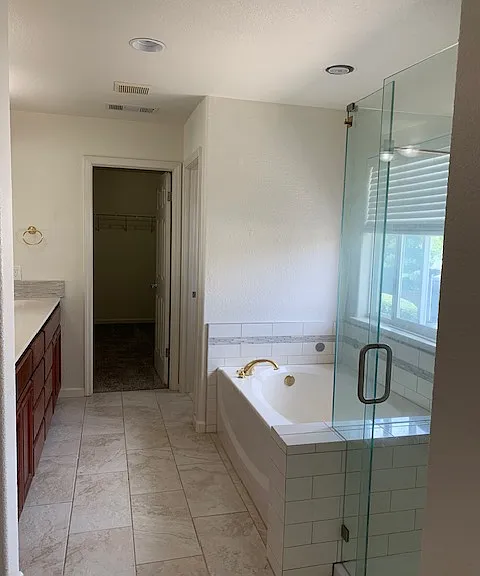 Master bedroom bathroom with walk-in closet