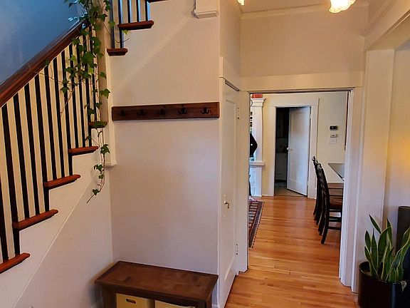 Inside the front door.
