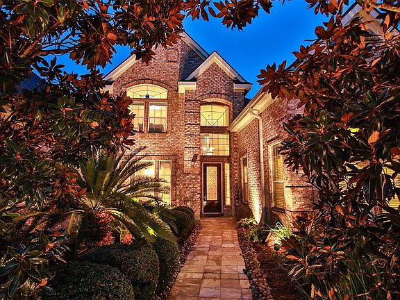Welcome to this wonderful home in Northwest Houston's premier subdivision of Rock Creek. The curb appeal of this home starts at the front walk complete with lush landscaping and lighting.