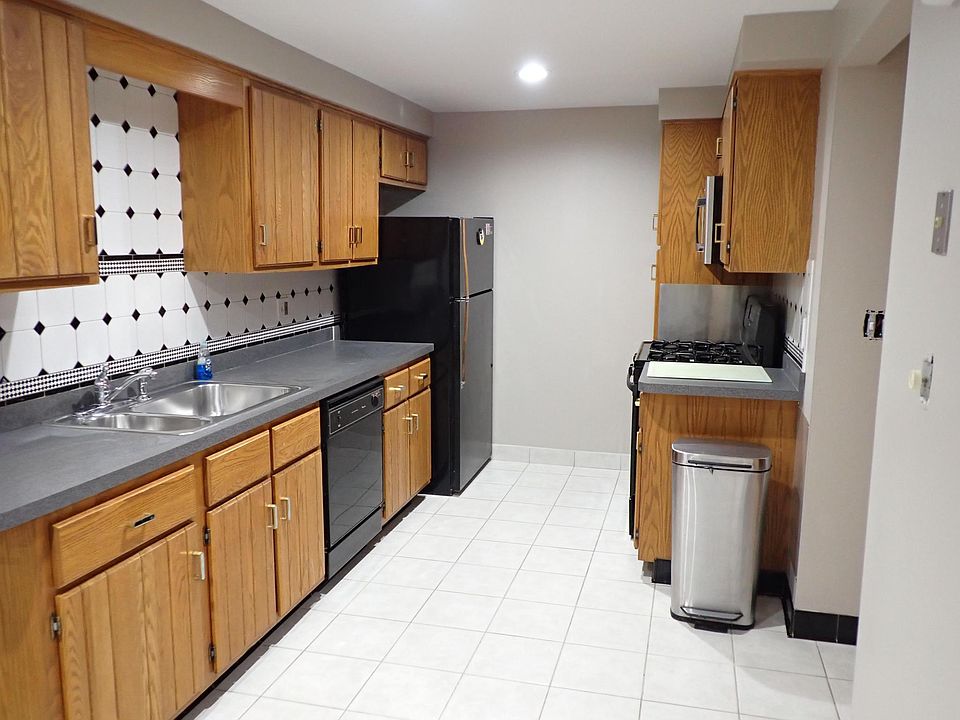 Kitchen Overhead Lighting, ceramic tile floor and ceramic tile backsplash.