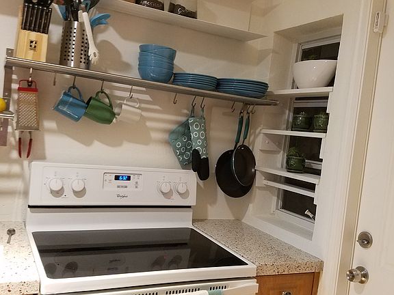 Glass top stove with oven. Door to back yard.