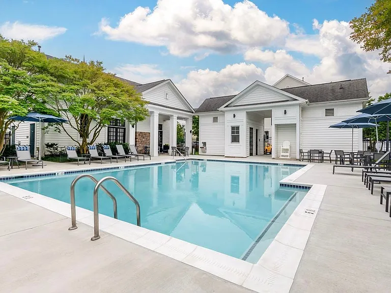 Swimming pool and sundeck with lounge seating