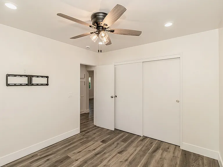 Bedrrom w/LVP Flooring, Dual Pane Windows, Fan and LED lighting.