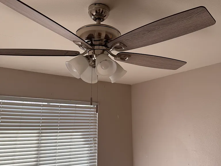 Lighted ceiling fans in three rooms.